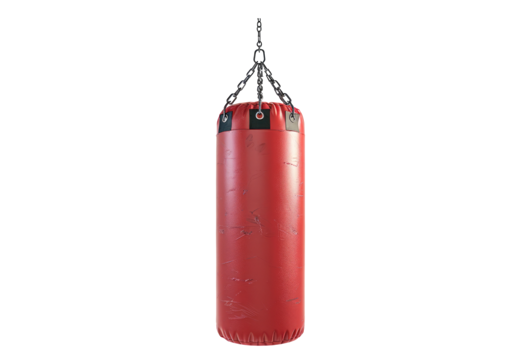 a red punching bag hanging on a chain