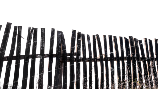 a wooden fence in front of a white sky