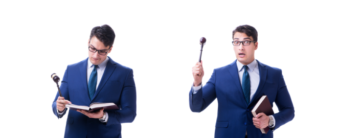 a man in a suit and tie holding a book