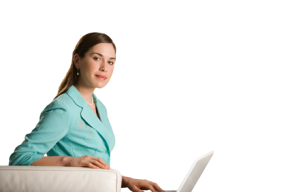 a woman sitting on a couch using a laptop