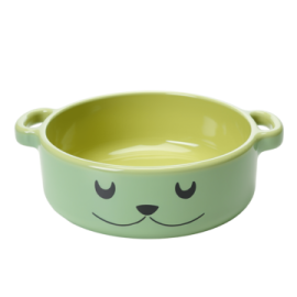 a green bowl with a smiling face on it