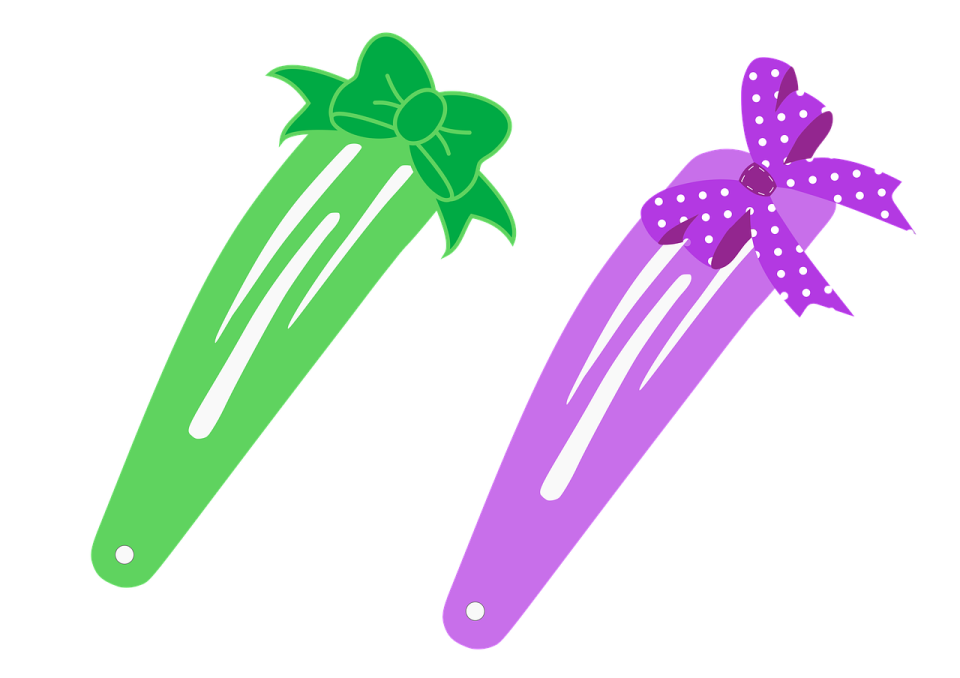 three different colored hair clips with bows