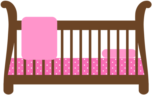 a baby cribt with pink and brown accents