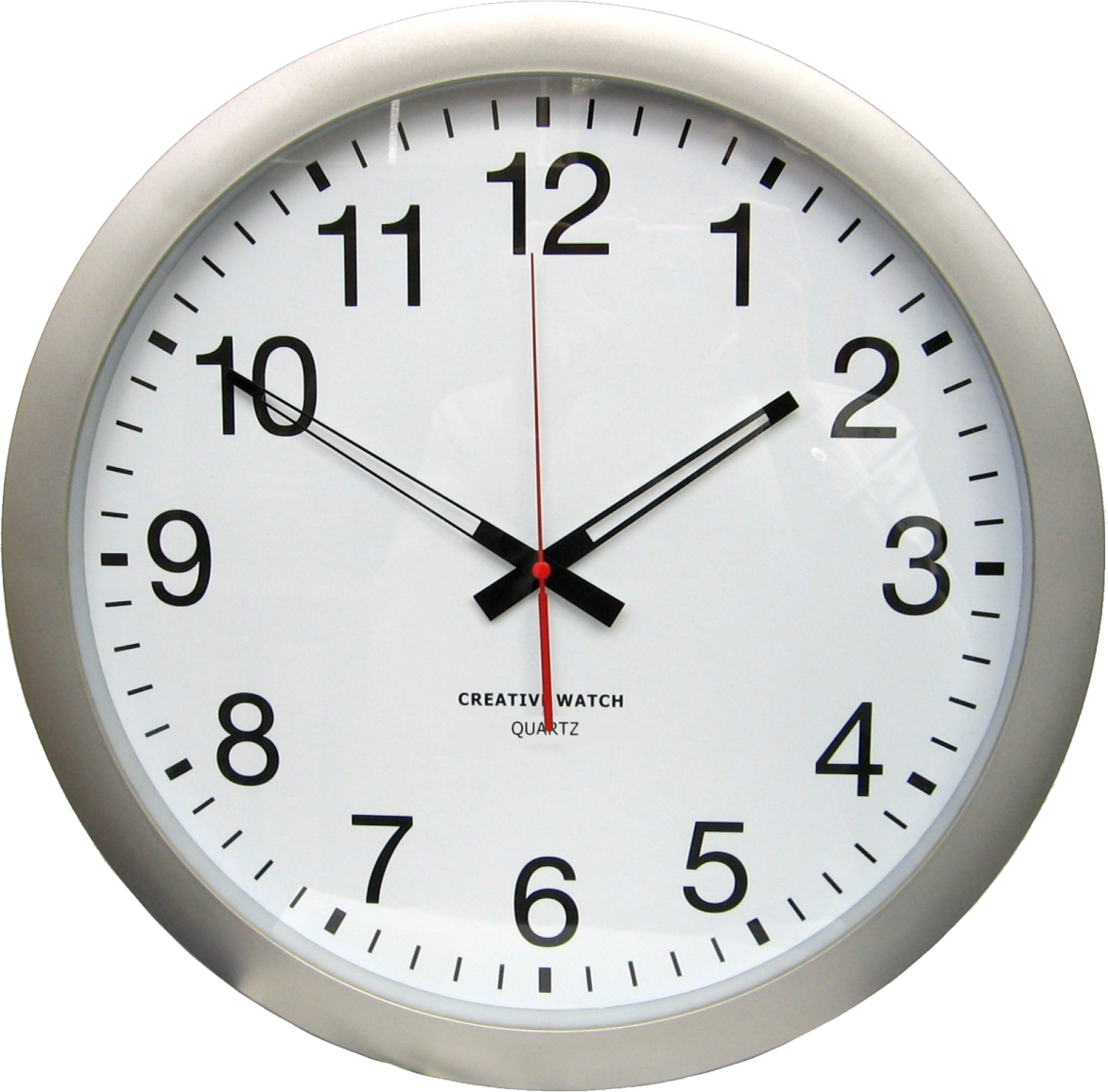 a white clock with black numbers on it