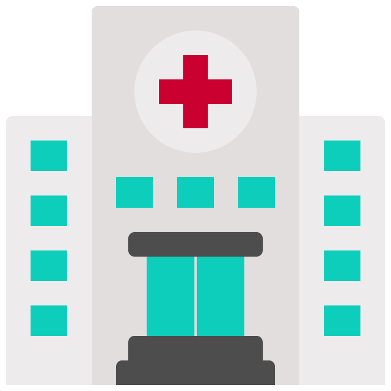a hospital building with a red cross on top