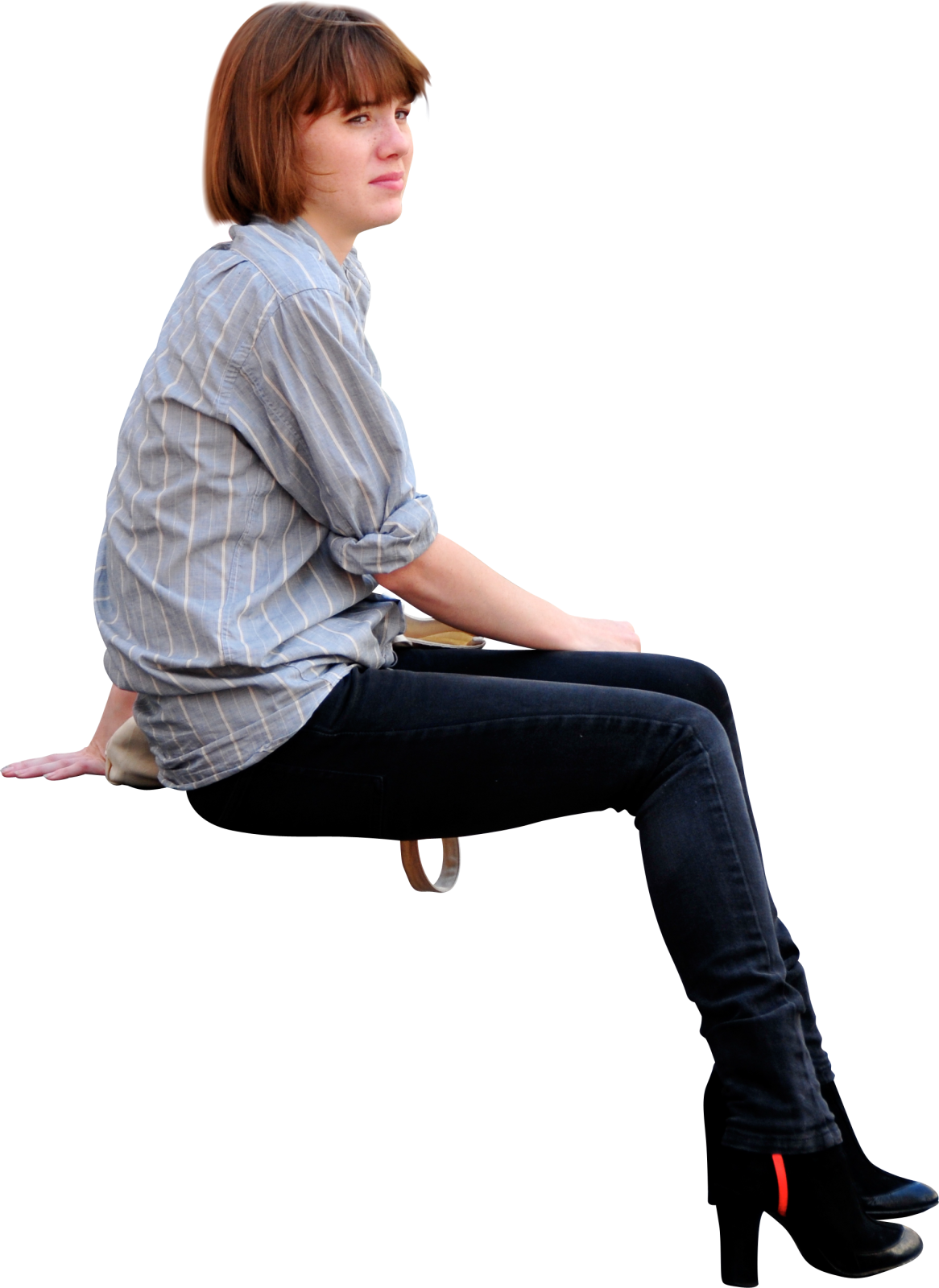 a woman sitting on a chair with her legs crossed