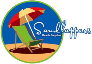 a beach chair with an umbrella in the sand