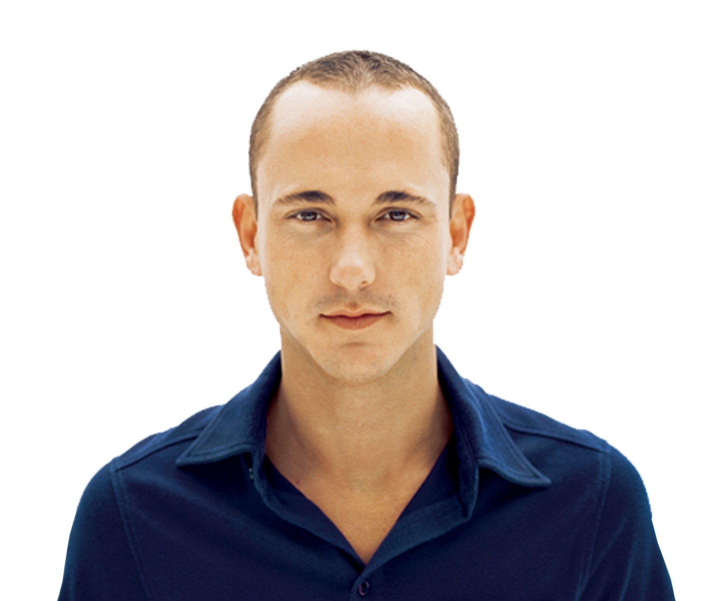 a man in a blue shirt is looking at the camera