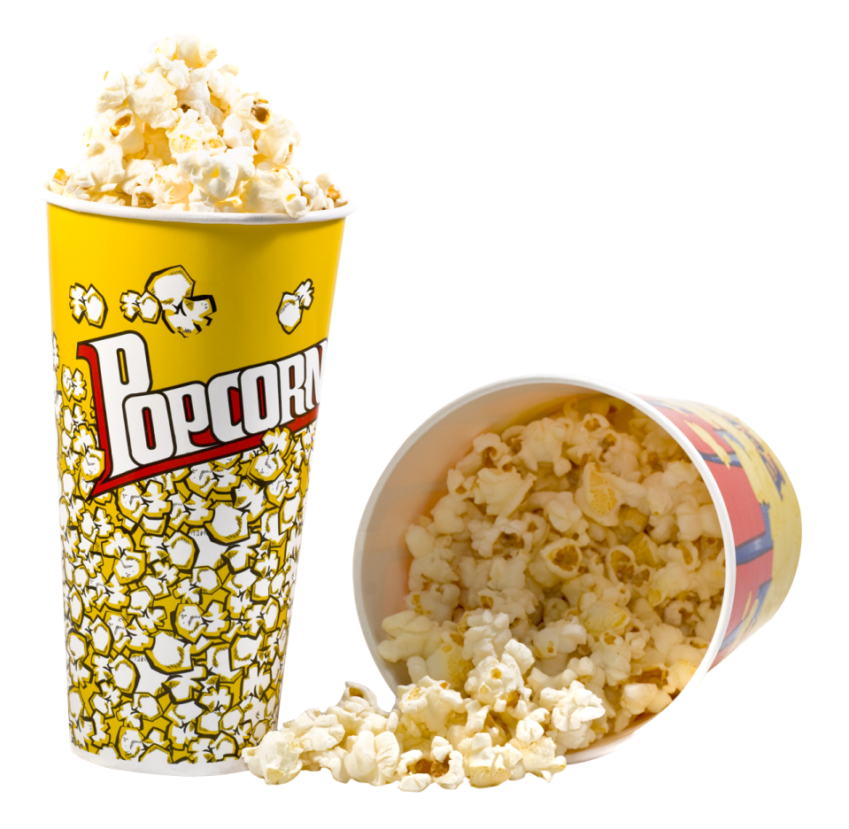 a cup filled with popcorn next to a container of popcorn
