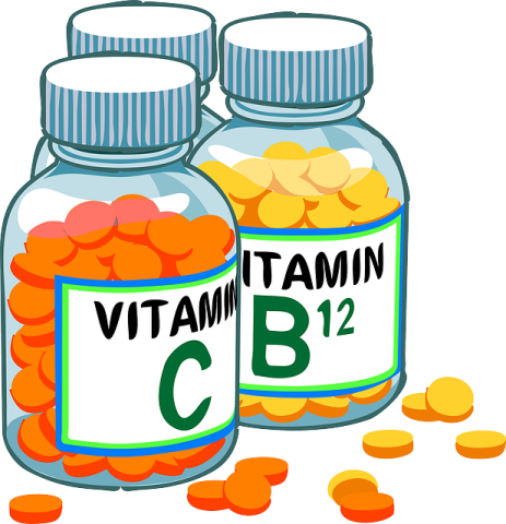 two bottles of vitamin with the word vitamin on them