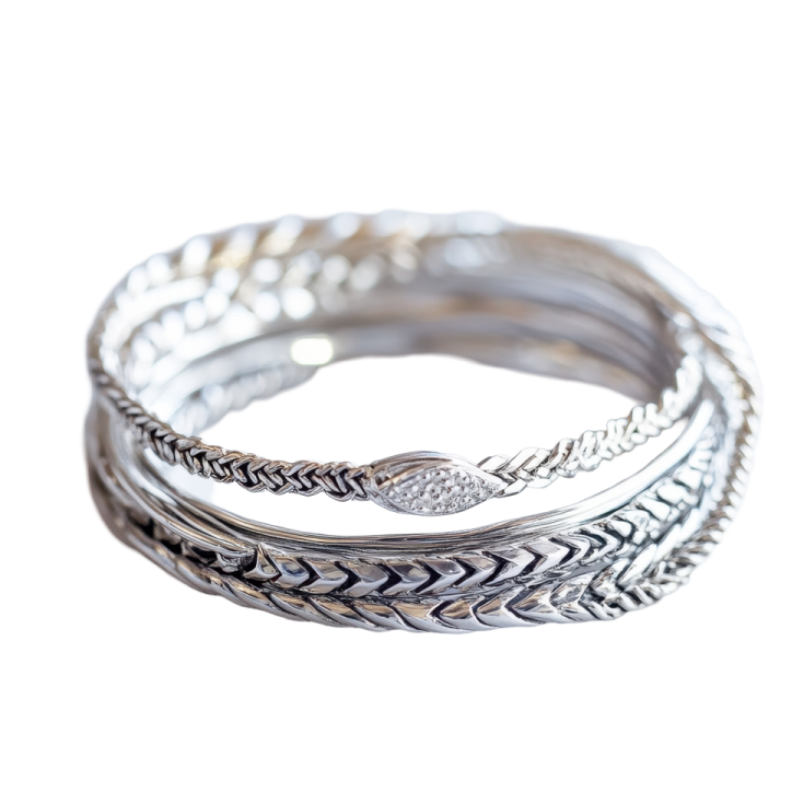a stack of silver rings on a white background