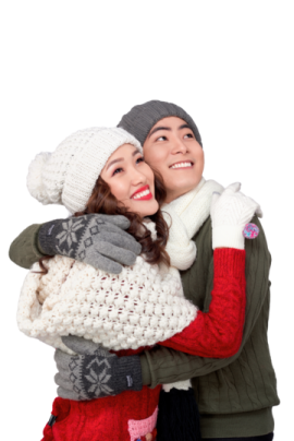 a man and woman hugging in the snow