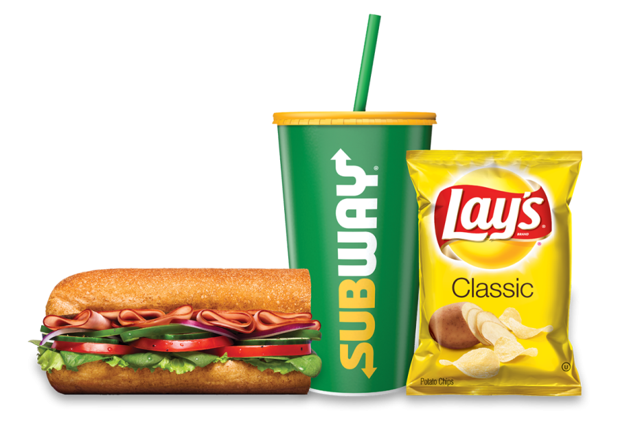a sandwich with a drink and a bag of chips