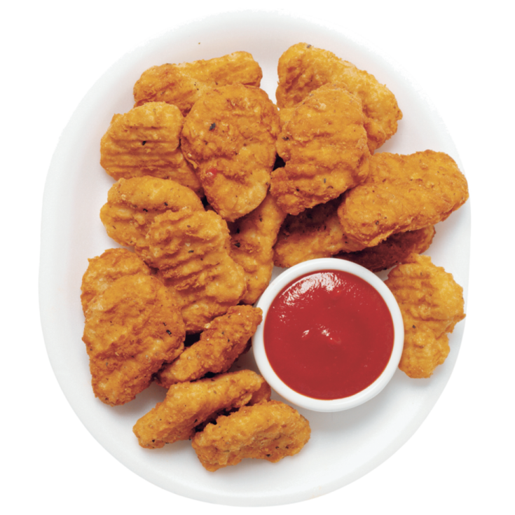 a plate of fried chicken with sauce on it