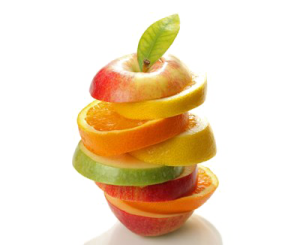 a stack of sliced fruit on a white surface