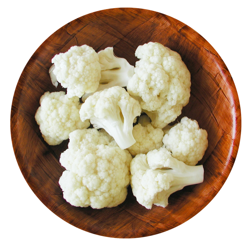 a wooden bowl filled with caulides