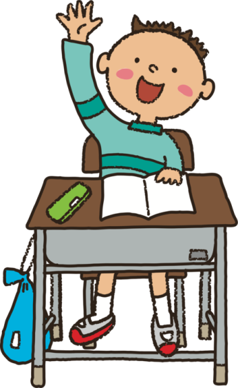 a boy sitting at his desk and raising his hand