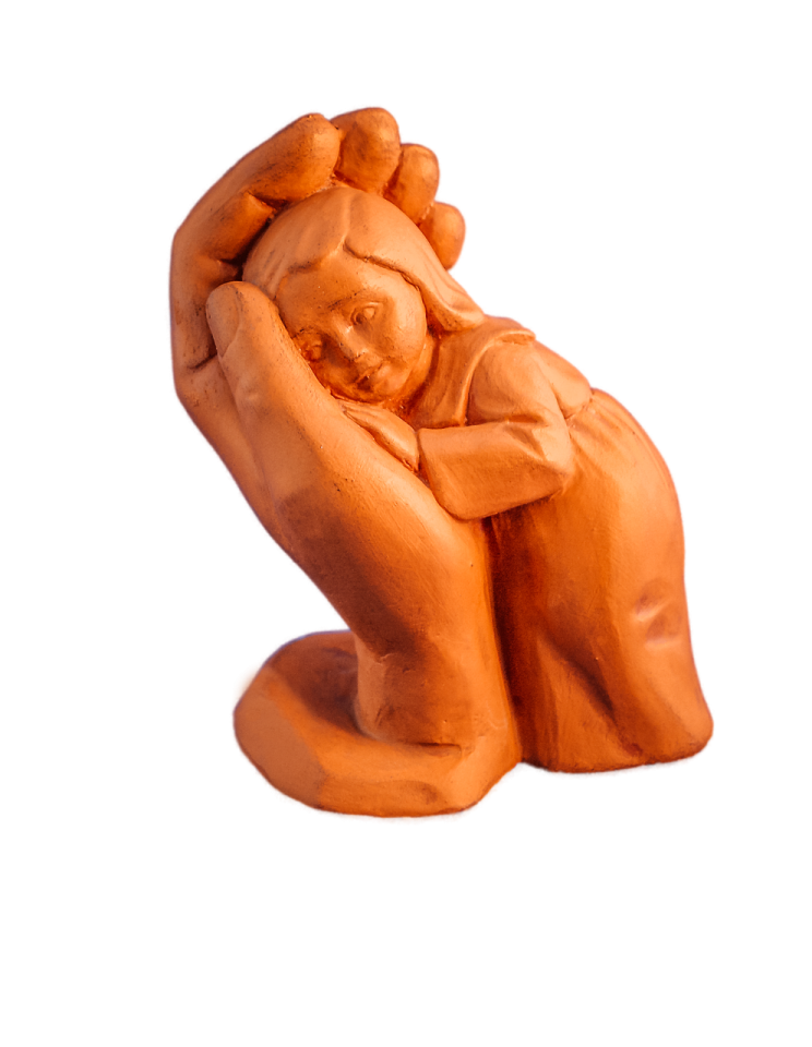a clay sculpture of a woman holding a baby
