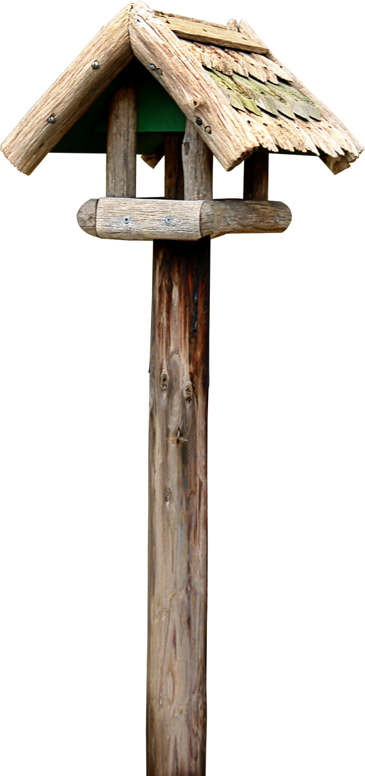 a bird house on top of a wooden pole