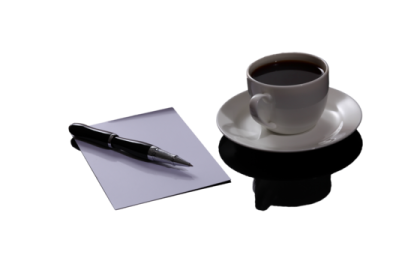 a cup of coffee and a pen on a paper