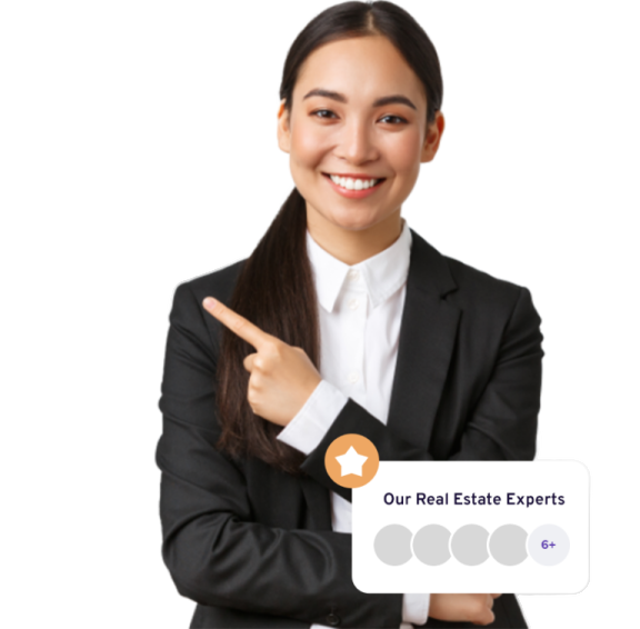a woman in a business suit pointing at the camera