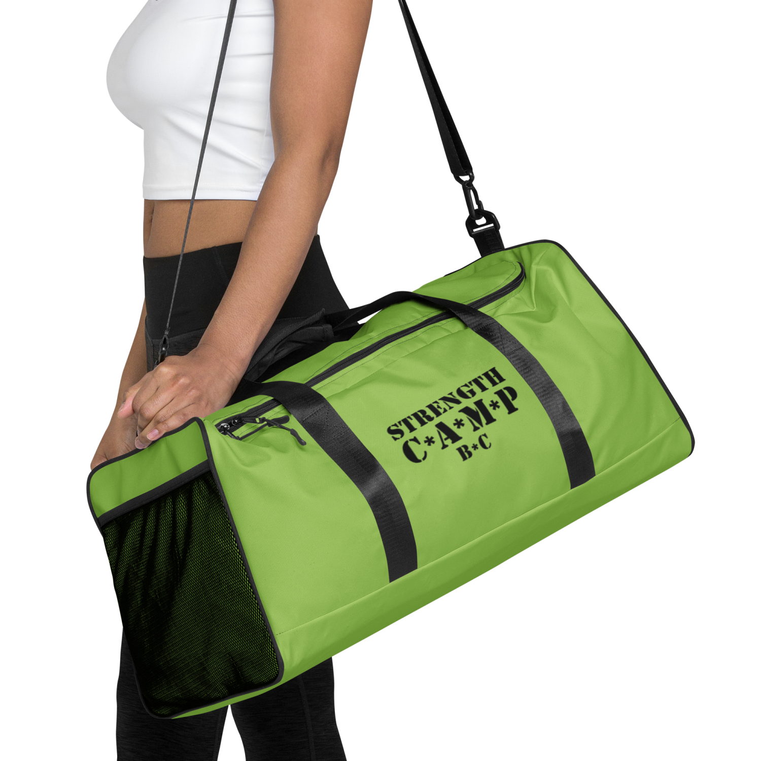a woman carrying a green gym bag