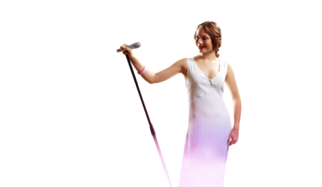 a woman in a white dress holding a microphone