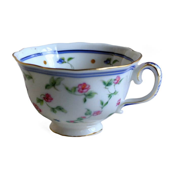 a white and blue cup with flowers on it