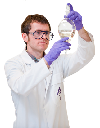 a man in a lab coat holding a flask