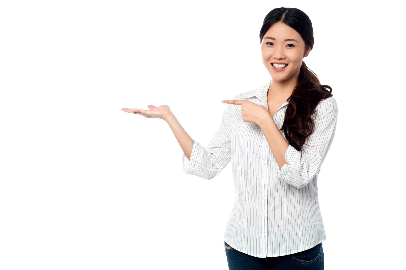 a woman in a white shirt and jeans points at something