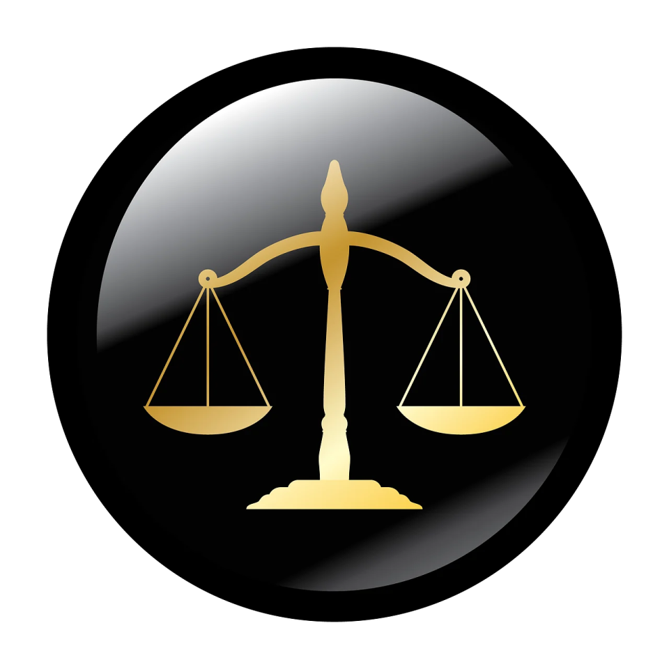 a black and gold scales of justice symbol
