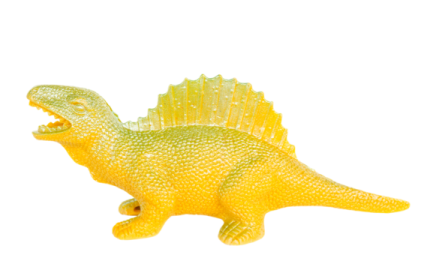 a yellow toy dinosaur on a white background