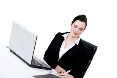 a woman sitting at a desk with a laptop