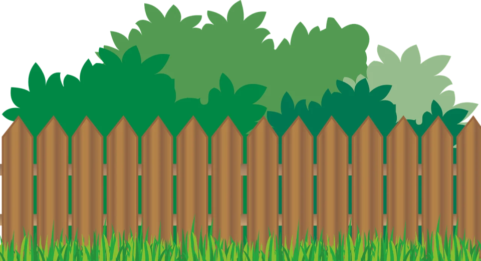 a wooden fence with grass and trees