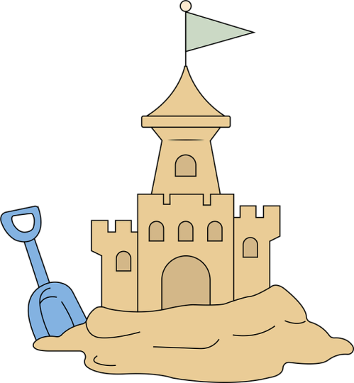a sand castle with shovel and flag