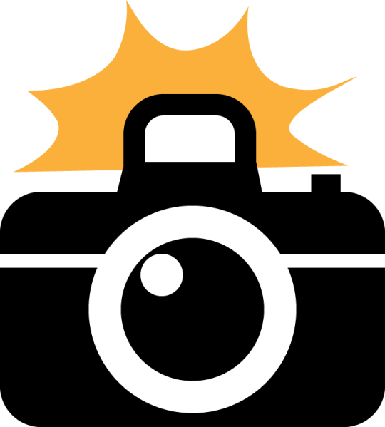 a camera with the sun in the background