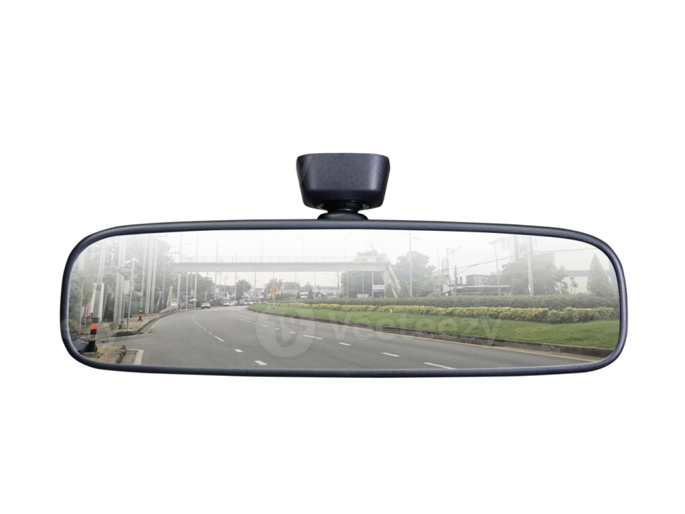the rear view mirror of a car on a road