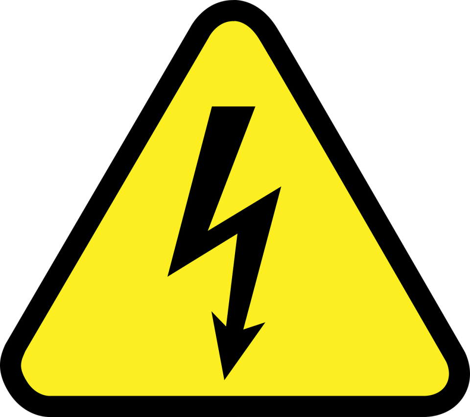 a yellow and black sign with a lightning bolt