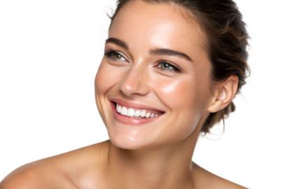 a woman smiling and holding a toothbrush