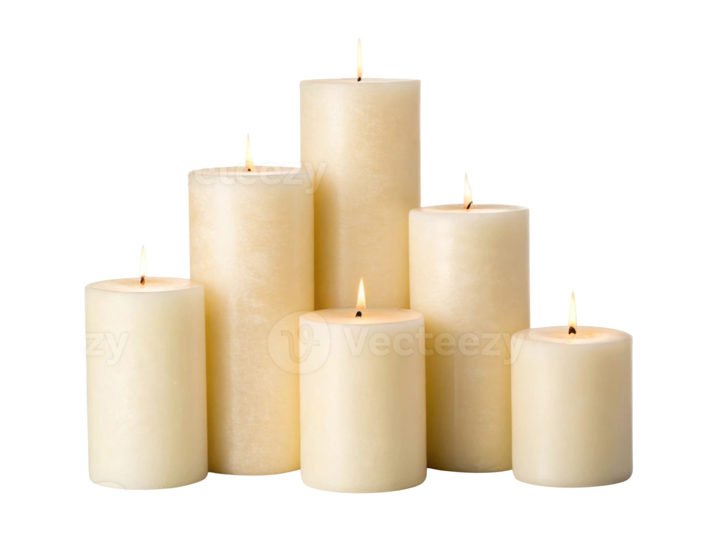 a group of white candles with one lit