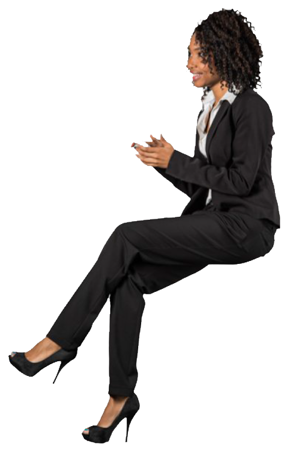 a woman in a business suit sitting on the ground