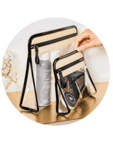 a hand holding a clear bag filled with various items