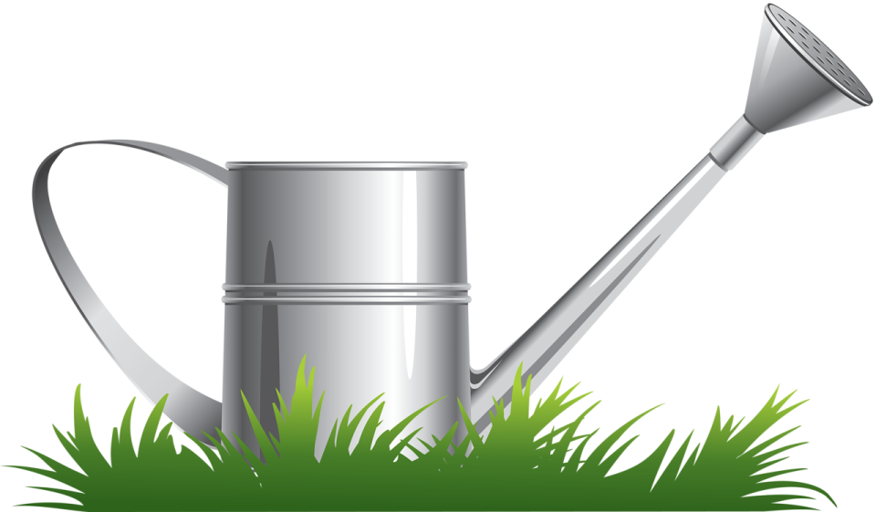 a watering in the grass with a shovel