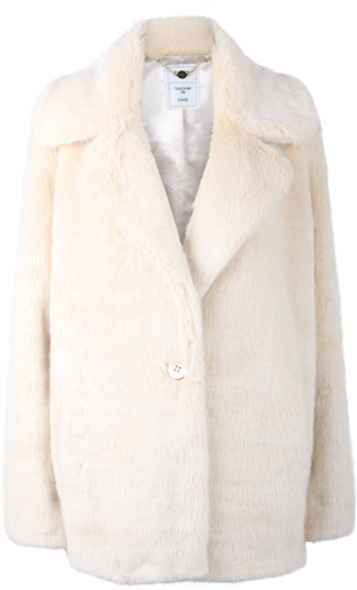 a woman wearing a white fur coat