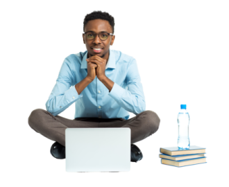 a man sitting on the floor with his laptop