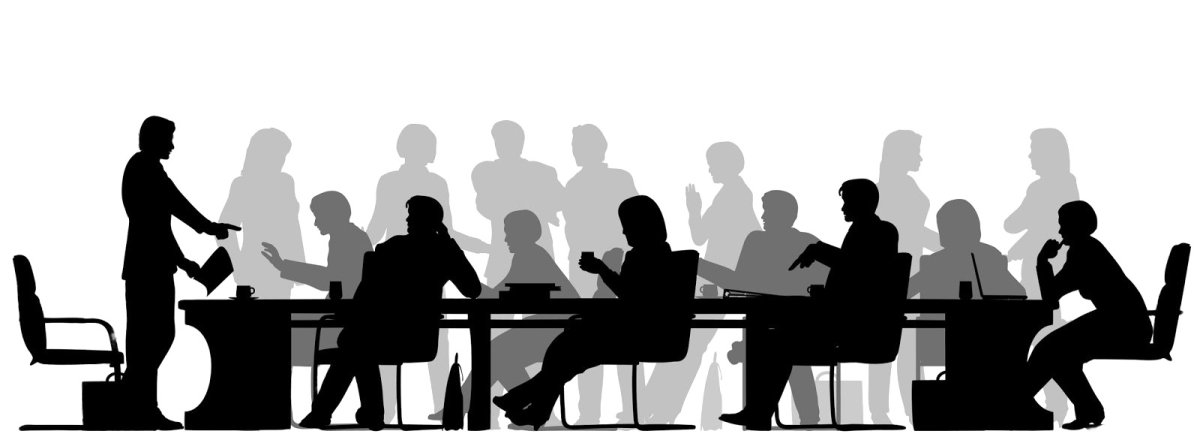 silhouettes of people sitting at a table