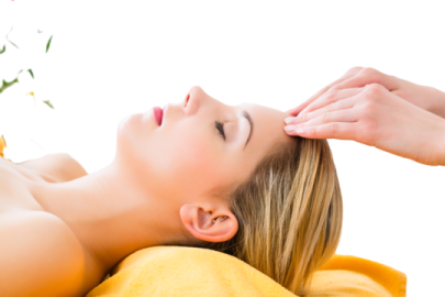 a woman getting a facial massage on her face