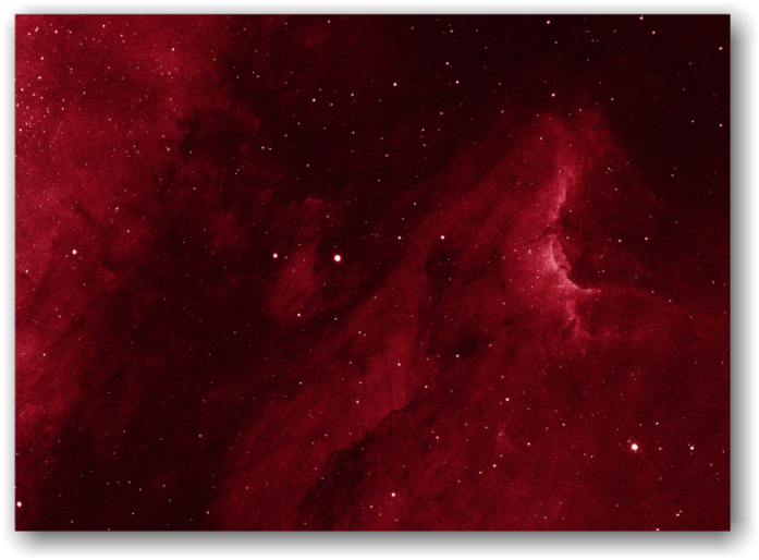 a large red nebula with stars in the background