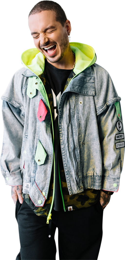 a man wearing a denim jacket with a green hoodie