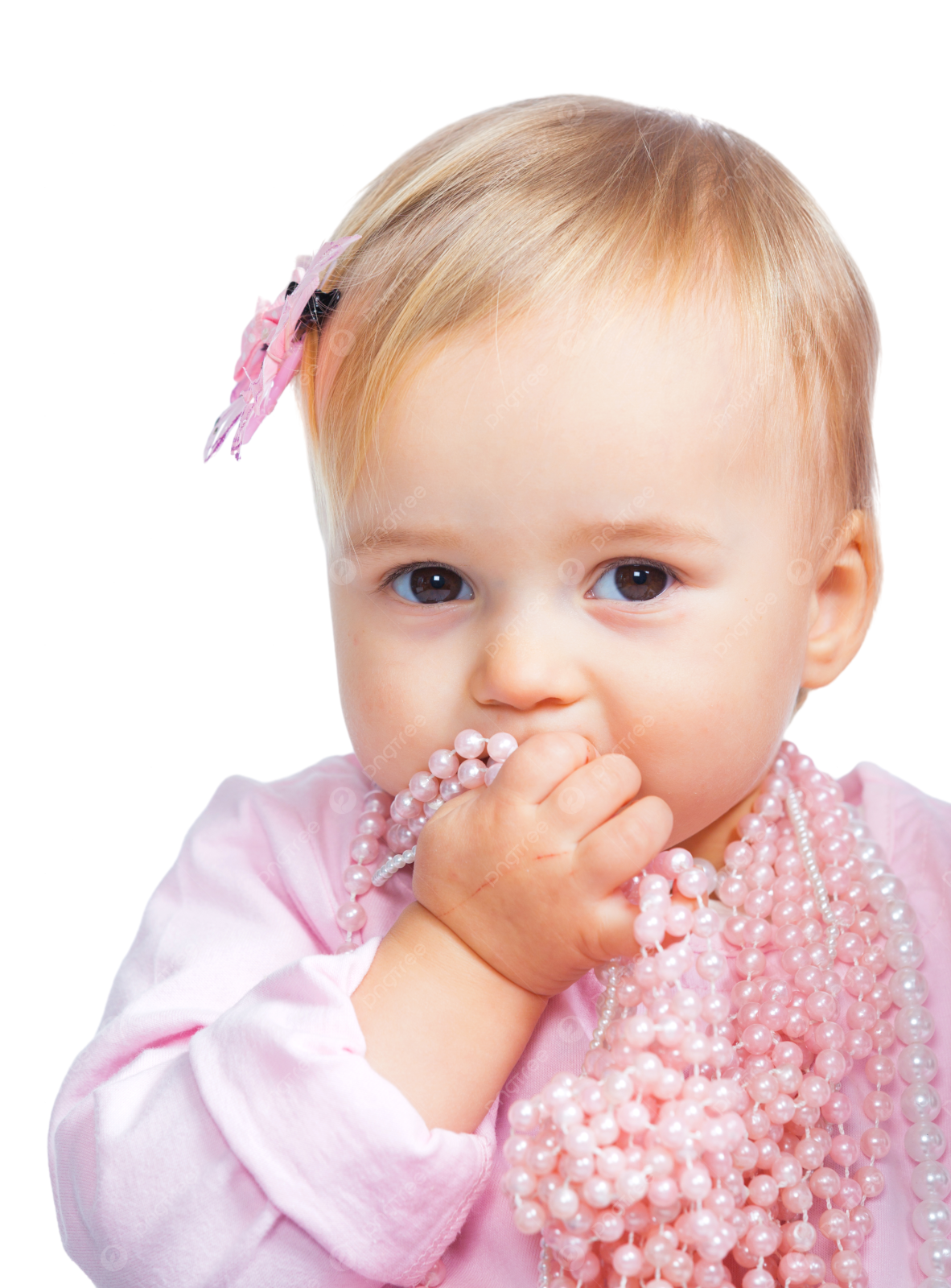 a baby girl wearing a pink dress and holding a pearl necklace